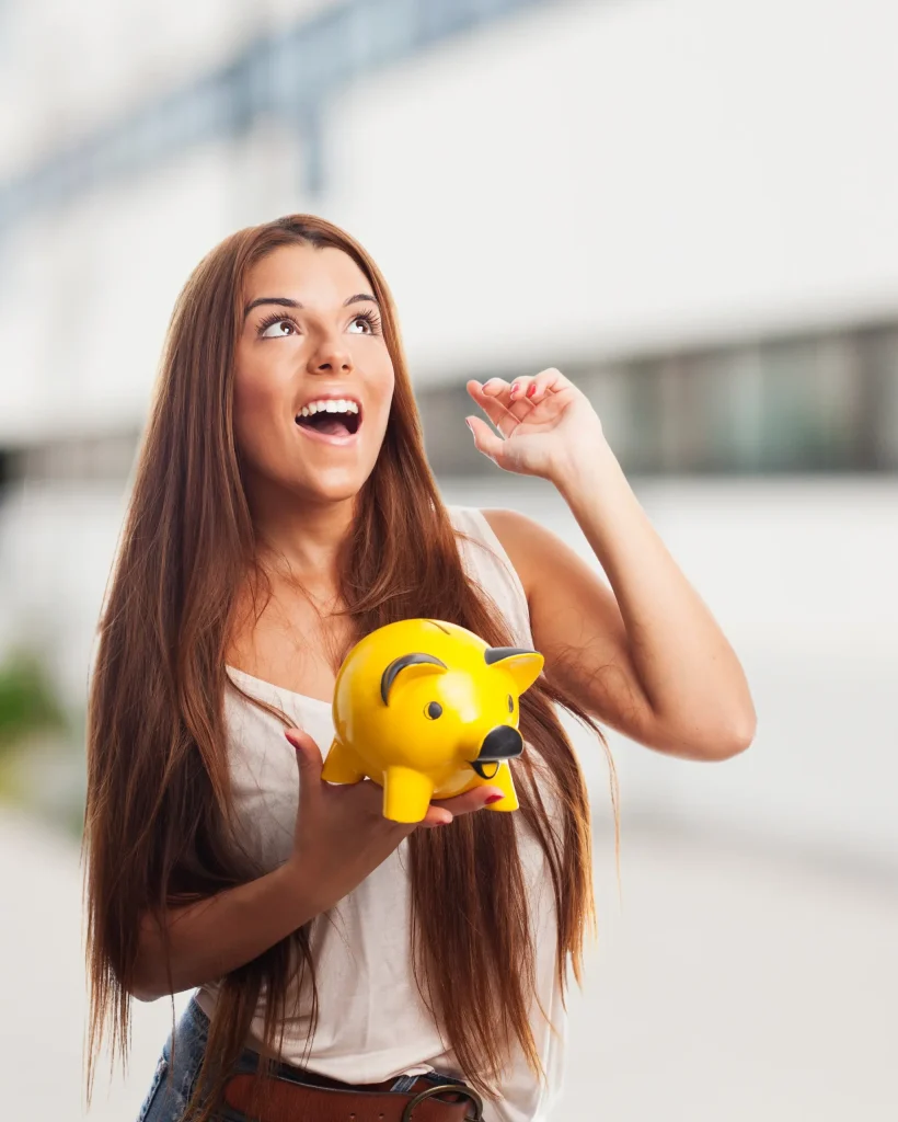 brunette-girl-holding-yellow-piglet-moneybox copy