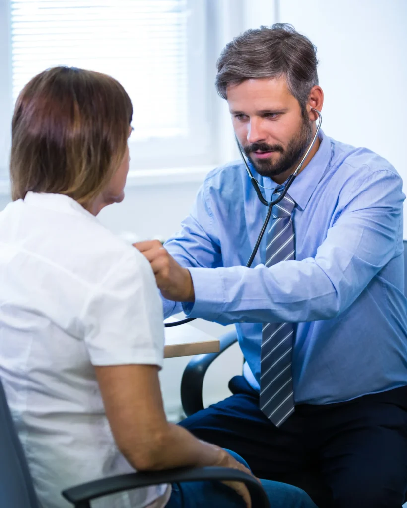 male-doctor-examining-patient copy - Copy